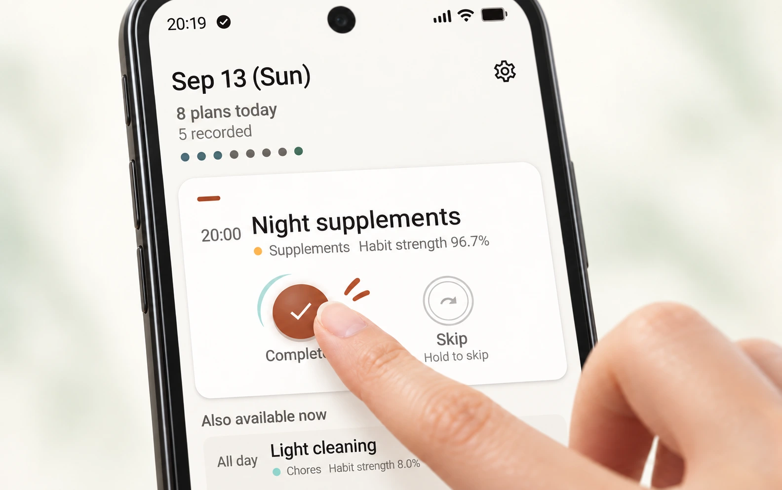 A fingertip taps Complete on the Today screen, with motion strokes and a ripple suggesting a light, springy tap.
